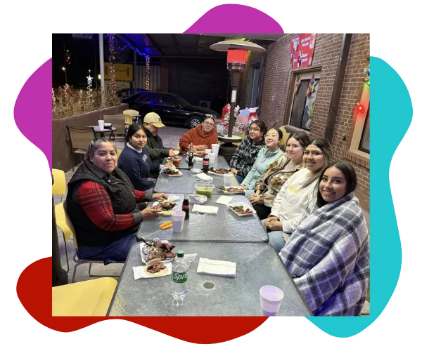 Group of people eating together on the patio at Hatch Corner Snacks & More in Hatch New Mexico