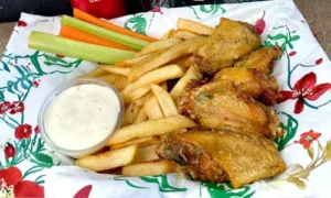 Chicken wings with fries, celery, carrots, and dipping sauce from Hatch Corner Snacks & More in Hatch New Mexico