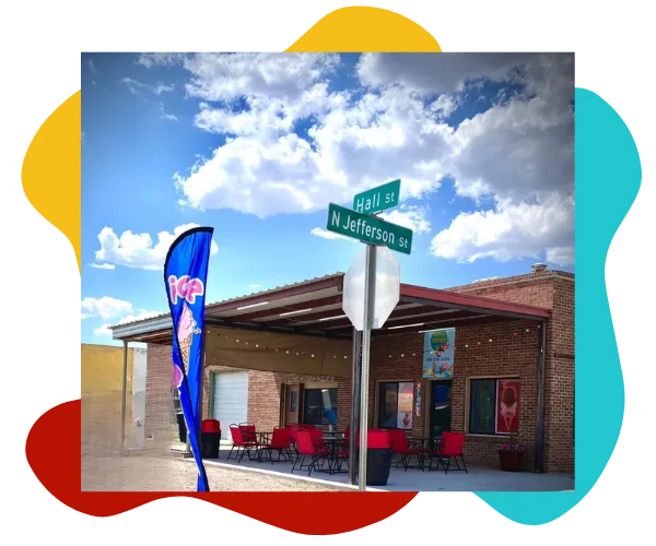 Exterior of Hatch Corner Snacks & More with outdoor seating near Hall Street and Jefferson Street in Hatch New Mexico