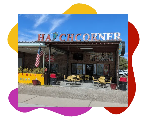 Hatch Corner Snacks & More storefront with outdoor tables and signage in Hatch New Mexico